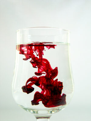 Red Color in Glass of Water